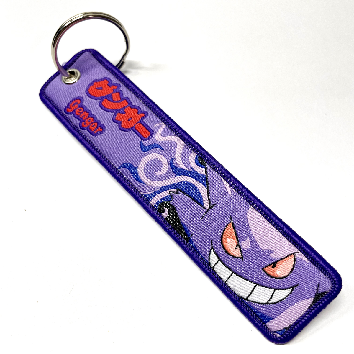 Llavero Gengar de tela morado con diseño bordado y anilla metálica